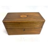 A MAHOGANY STATIONARY BOX with an oval floral inlaid decoration to the centre top, which opens to