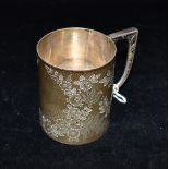 A LATE VICTORIAN SILVER CUP the cup engraved with flora and fauna pattern, the handle with