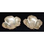 A PAIR OF EDWARDIAN SILVER BON BON DISHES the dishes of scalloped form with embossed scroll borders,