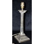 A WEIGHTED SILVER CANDLESTICK CONVERTED FOR LAMP USE The candlestick of Corinthian design with faded