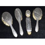 A COLLECTION OF FIVE HALLMARKED SILVER BACKED BRUSHES Condition: The brushes showing age-related