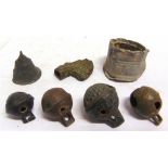 METAL DETECTING FINDS - ASSORTED comprising crotal bells; a lead bird feeder; and two other items.