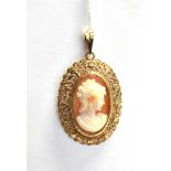 A CAMEO PENDANT PIECE the cameo raised and set in an ornate pierced yellow metal mount, the