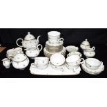 A GROUP OF VIENNA PORCELAIN TEAWARES including teapot, two lidded sucrieres, three jugs, nine