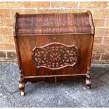 A ROSEWOOD CABINET with domed shaped top and raised on ceramic casters H 53.5cm x W 56cm x D 30cm