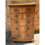 A MAHOGANY VENEERED CHEST OF A LONG DRAWER, OVER TWO SHORT WITH THREE LONG GRADUATING DRAWERS