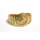 A 9CT GOLD BELT AND BUCKLE RING with patterned detail, the ring with faded 9.375 mark, size W-X,