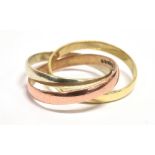 A 9CT GOLD, TRI COLOURED TRINITY RING comprising three interlocked rings in rose, yellow and white