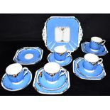 A COLLECTION OF SHELLEY 'LOMOND' SHAPE TEA WARE decorated with fruit and leaves on a blue ground,