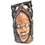 A LARGE AFRICAN CARVED HARDWOOD WALL MASK 60cm high