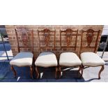 A SET OF FOUR DINING CHAIRS having shield backs with inlaid decoration and with upholstered seats