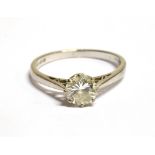 AN 18CT WHITE GOLD DIAMOND SOLITAIRE RING The round cut diamond measuring 0.5cm in diameter and