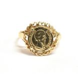 A 9CT GOLD MAXIMILIANO EMPERADOR MEDALLION RING the ring with rubbed 375 hallmark, size O ½ - P,