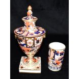 A 19TH CENTURY IMARI PALETTE LIDDED VASE probably Chamberlains, Worcester, 23cm high; and a matching