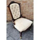 AN EDWARDIAN CARVED WALNUT BUTTON UPHOLSTERED SALON CHAIR on brass casters Condition Report : re-