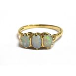 A 9CT GOLD OPAL TRIPLE STONE DRESS RING the ring with faded marks, opal measurement 0.6 x 0.4cm
