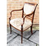 AN EDWARDIAN CROSSBANDED MAHOGANY UPHOLSTERED SALON ARMCHAIR on ring turned splayed front supports
