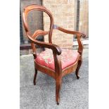 A CONTINENTAL WALNUT ARMCHAIR with tapestry upholstered drop-in seat, on cabriole supports Condition