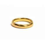 A 22ct GOLD BAND RING With rubbed Birmingham Hallmark, ring size J ½, weight 5grams