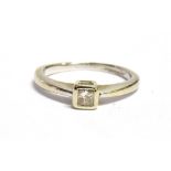 A PRINCESS CUT DIAMOND SOLITAIRE RING the diamond set in unmarked white metal that tests as