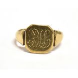 A 9CT GOLD SIGNET RING the ring with monogrammed bezel, hallmarked for Birmingham 1946, maker BS,