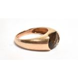 A MARKED 9K BROWN TOURMALINE RING The faceted Tourmaline, horizontally set in a yellow metal tapered