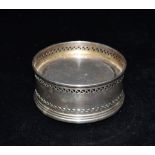 A SILVER COASTER hallmarked for Birmingham 1996, maker B&Co, height 4cm, diameter 9cm Condition