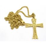 A 9CT CARAT GOLD CROSS PENDANT AND CHAIN the cross with engraved front pattern suspended on a fine