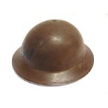 MILITARIA - A SECOND WORLD WAR BRITISH STEEL HELMET retaining much of its original khaki paint (with