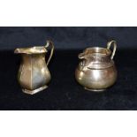 TWO SILVER CREAMERIES hallmarked for London 1972, with rounded belly, height including handle top,