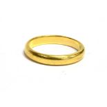 A 22CT GOLD BAND RING the ring hallmarked for Birmingham 1958, maker H.S. ring size L ½ -M, weight