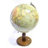 A TERRESTRIAL GLOBE mid 20th century, printed in Germany, the base with integral compass, overall