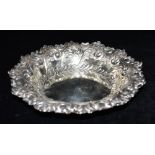 A LATE VICTORIAN SILVER DISH the dish with embossed pattern sides and rim, hallmarked for