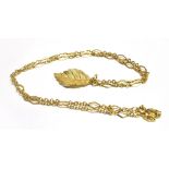A MARKED 375 FANCY LINK NECKLACE With a yellow metal textured leaf pendant attached (faded marks