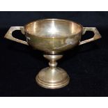 A TWIN HANDLED PEDESTAL BASE SILVER TROPHY height 10.3cm, bowl diameter 10cm, weight 131g, 4 Troy