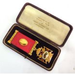 A ROYAL ANTEDILUVIAN ORDER OF BUFFALOES KNIGHT OF THE ORDER OF MERIT ENAMELLED 9CT GOLD MEDAL