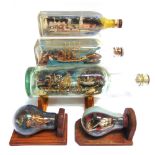 NAUTICALIA - THREE SHIPS IN BOTTLES the largest 29.5cm long overall; together with two ships in