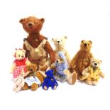 EIGHT HERMANN COLLECTOR'S MINIATURE TEDDY BEARS the largest 18cm high.