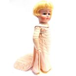 A KESTNER BISQUE SOCKET HEAD DOLL with a bobbed blonde wig, sleeping blue glass eyes, and a closed