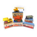 FOUR DINKY DIECAST MODEL VEHICLES comprising a No.563, Heavy Tractor, orange with green wheels, fair
