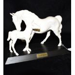 A BESWICK EQUESTRIAN GROUP Spirit of Affection of a Mare and Foal, in white matt standing on a