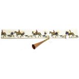 A COAT RACK for wall mounting, upholstered with hunting scene and with six cartridge hooks, 90cm
