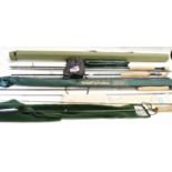 FIVE VARIOUS FISHING RODS comprising a Sonik sk3 10'6' rod with bag and a carrying case, a Total Fly
