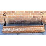 A NEWLYN SCHOOL ARTS & CRAFTS COPPER FIRE KERB embossed decoration of stylised fish, 106cm wide