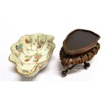 A CHINESE PORCELAIN LEAF SHAPED BOWL with raised and lobed sides, polychrome painted with insects