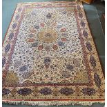 AN IVORY GROUND RUG 132cm x 207cm Condition Report : rather dirty, some signs of old moth damage