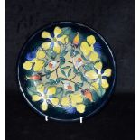 A MOORCROFT 'HYPERICUM' PATTERN PLATE impressed marks, painted monograms and date code for 1994 to
