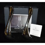 CONSTANTIN WORTMANN FOR GEORG JENSEN: a pair of stainless steel 'Cobra' candelsticks, 24cm high,