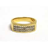 AN 18CT GOLD PAVE SET DIAMOND RING The diamond panel pave set with 33 diamonds on a yellow gold