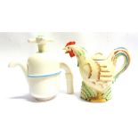 TWO NOVELTY TEAPOTS comprising on in the form of a hen, marked 'Made in England', 22cm long; and one